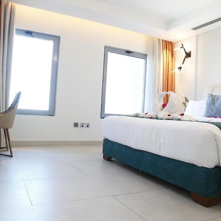 Waterfront Hotel Apartment Lusail Dış mekan fotoğraf A room at the hotel